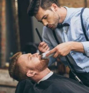 male-barber-trimming-customers-beard-in-barber-shop-e1623672340201-p8nj3cgx11dtob9ggconupjijrqsbhnmd8bcq6gc6w